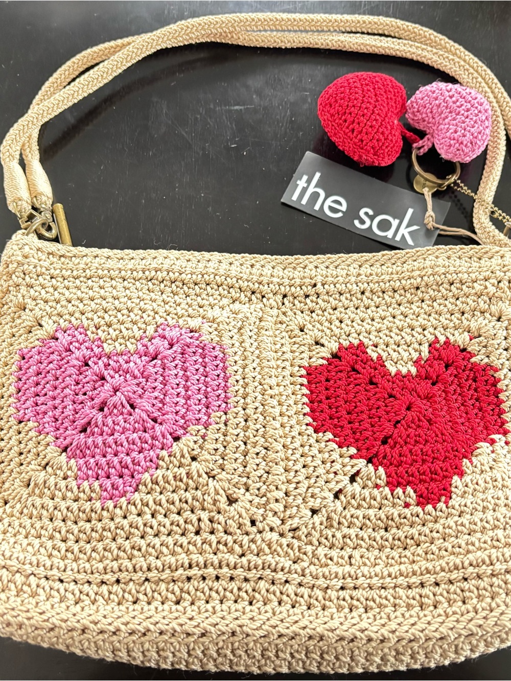 The Sak Beige Crochet Crossbody with Pink and Red Hearts